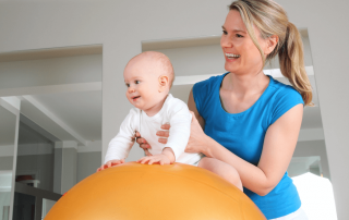 baby on therapy ball - early intervention program concept