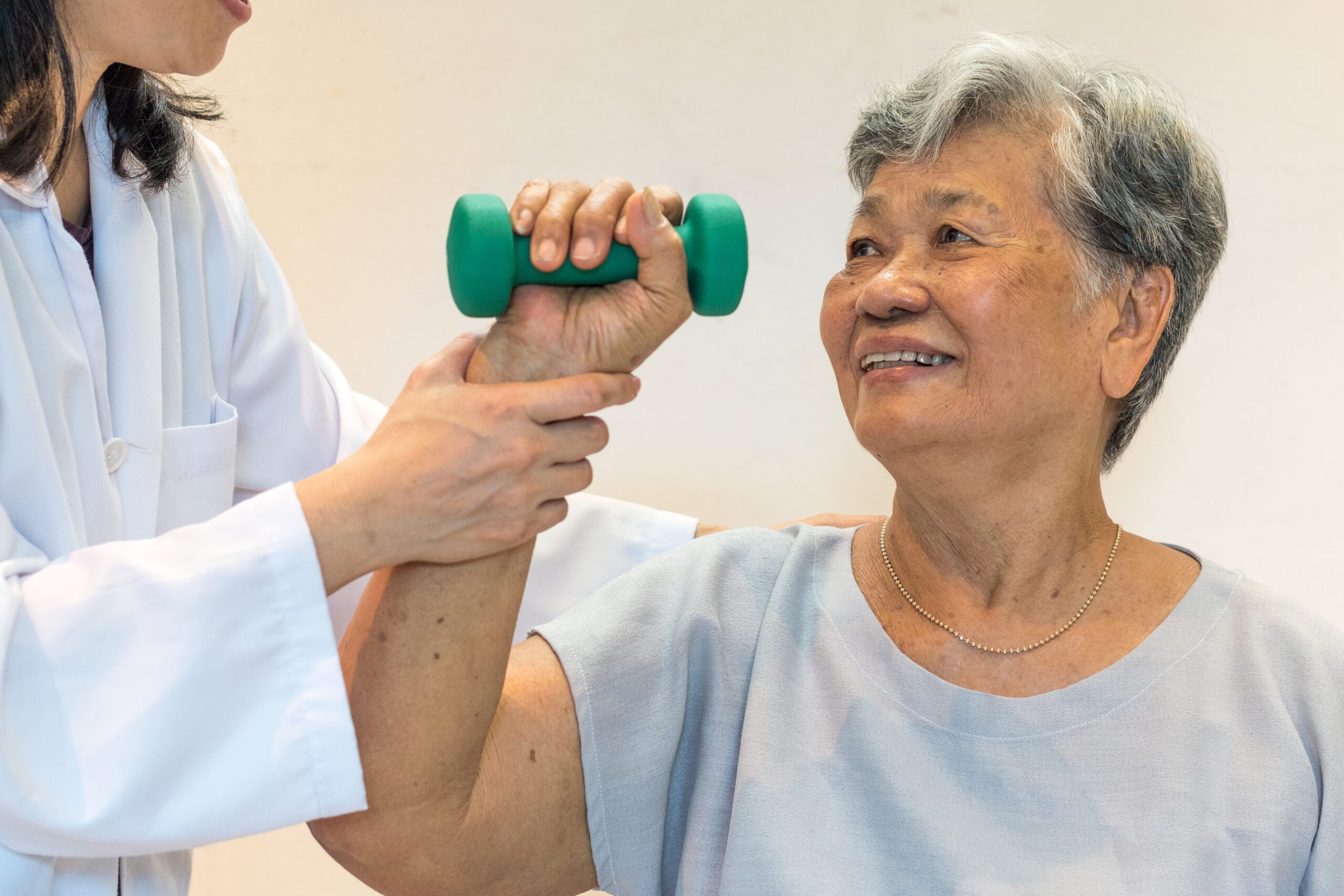elderly woman getting physical therapy - pt for seniors concept
