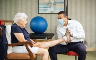 physical therapist helping woman seeking physical therapist in white plains